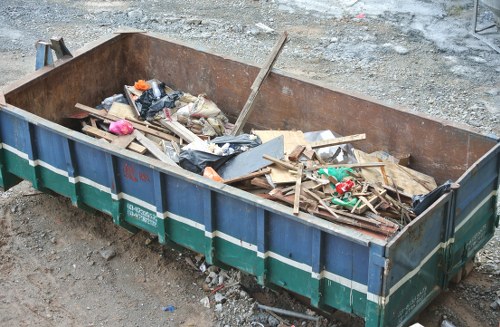 A professional waste clearance truck at a construction site in Tottenham Hale