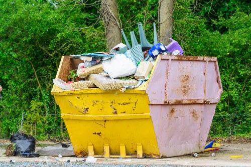 Construction site with cleared debris and eco-friendly recycling bins