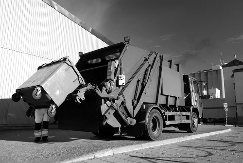 Waste clearance vehicles at a site in Goodmayes