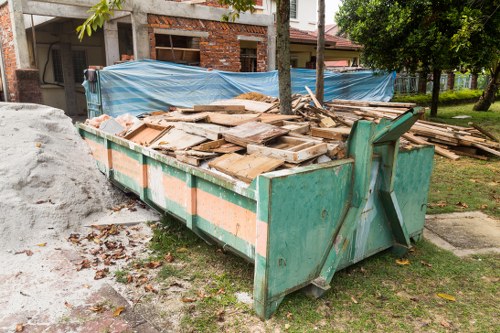 Construction debris clearance on a busy site in Millbank