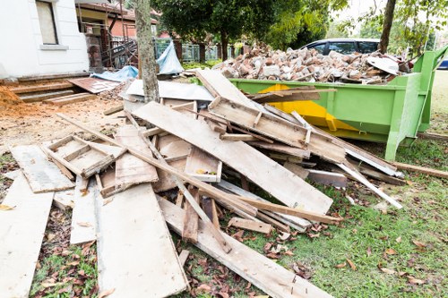 A freshly cleared garden area before professional cleanup