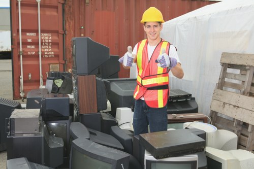 Workers efficiently clearing construction debris in Kentish Town