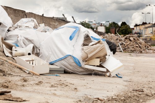 Construction site with debris being cleared in West Hendon