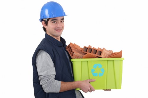 Workers managing builders waste at a construction site