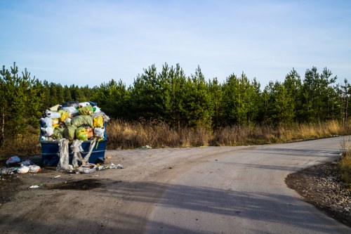 Heavy machinery assisting in waste removal