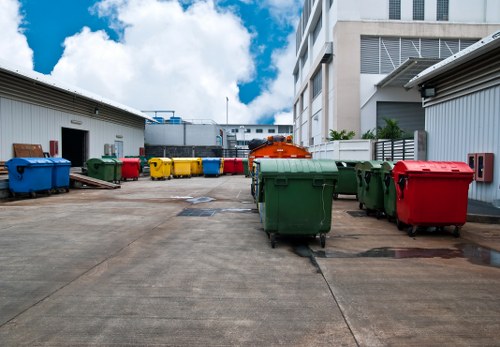 Workers managing builders waste during a clearance process.