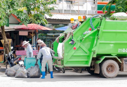 Professional waste clearance team handling construction waste