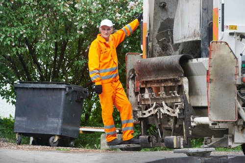 Professionals managing construction debris and hazards