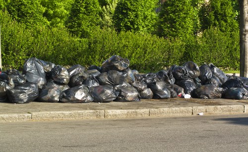 Engineers assessing construction debris during waste clearance process