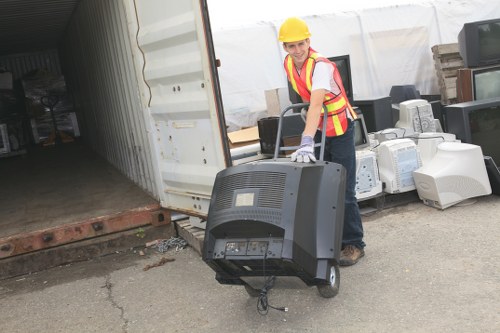 Modern waste clearance vehicle and equipment at a construction site