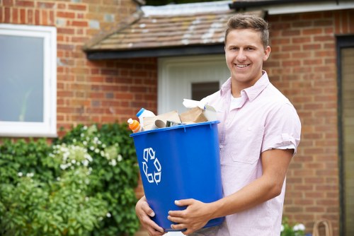 Construction workers managing waste on site in Harrow Weald