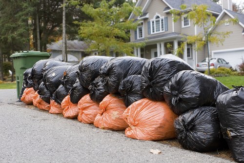 Professional team sorting and disposing of construction waste