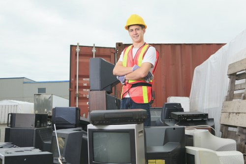 Workers assessing and segregating construction waste